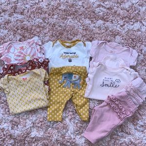 Bundle of newborn baby girl clothes